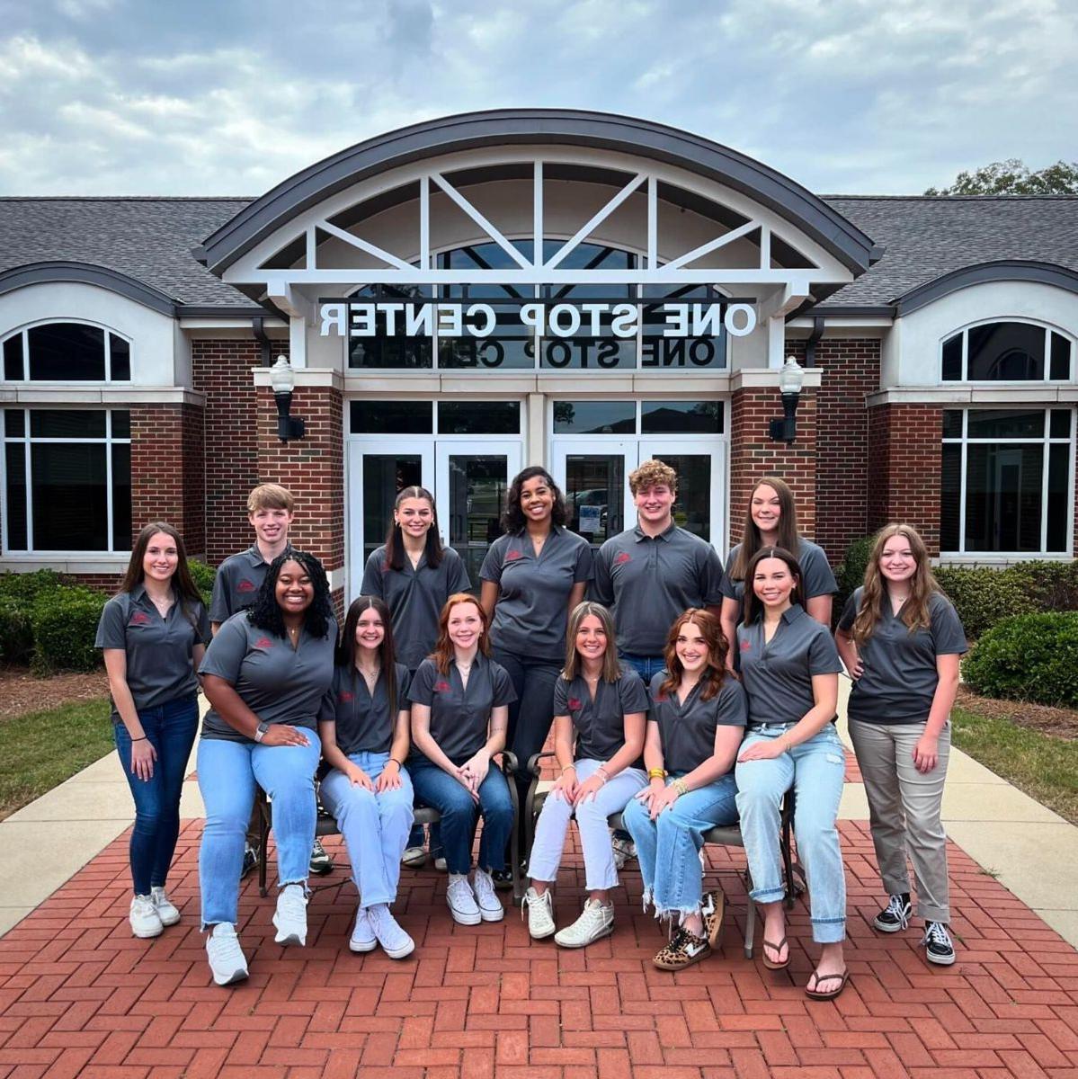 Group photo of 2024-25 Student Ambassadors outside the One Stop